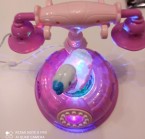 Telefón s melódiami a svetelnými efektmi